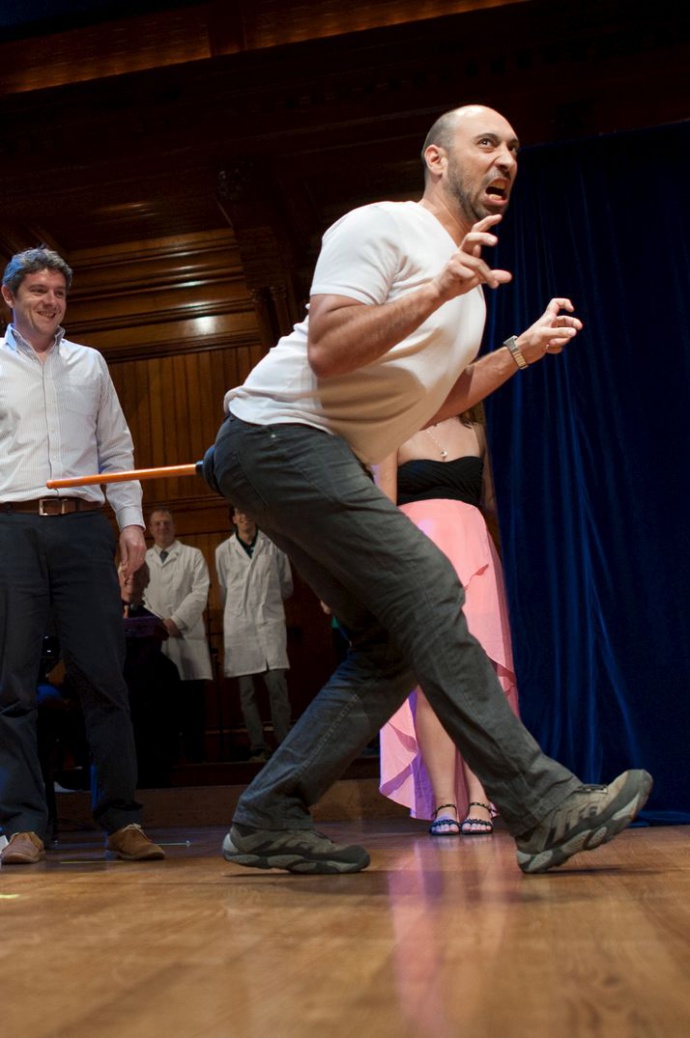 Grossi walks like a dinosaur as he and his team accept the Ig Nobel Prize in Biology at the 25th First Annual Ig Nobel Prizes awards ceremony at Harvard University in Cambridge